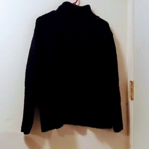 Boxy turtleneck sweater. Soft, chunky-knit fabric with heavily dropped shoulders